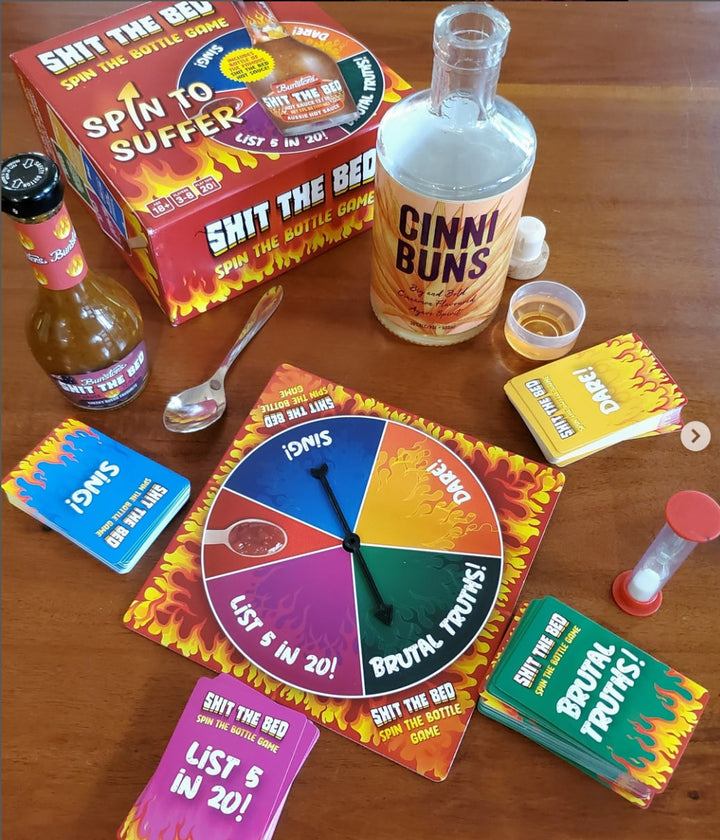 Shit the Bed adult board game box with its included hot sauce